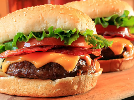 Texas Cheeseburger ... genuine Texas beef, tomato, and melted cheese on a thick bun